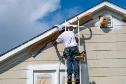 Painter painting house