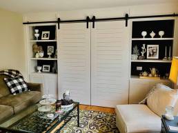 White painted barn door living room